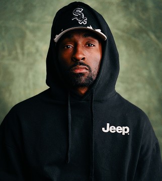 headshot of male in dark background