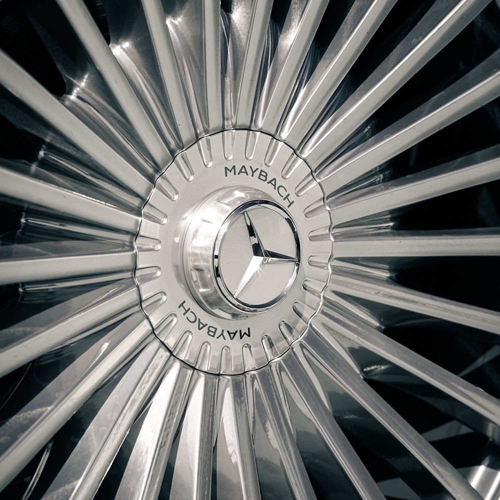 Close-up of the Mercedes-Maybach GLS 600 wheel with classic Maybach emblem, signifying ultimate luxury.