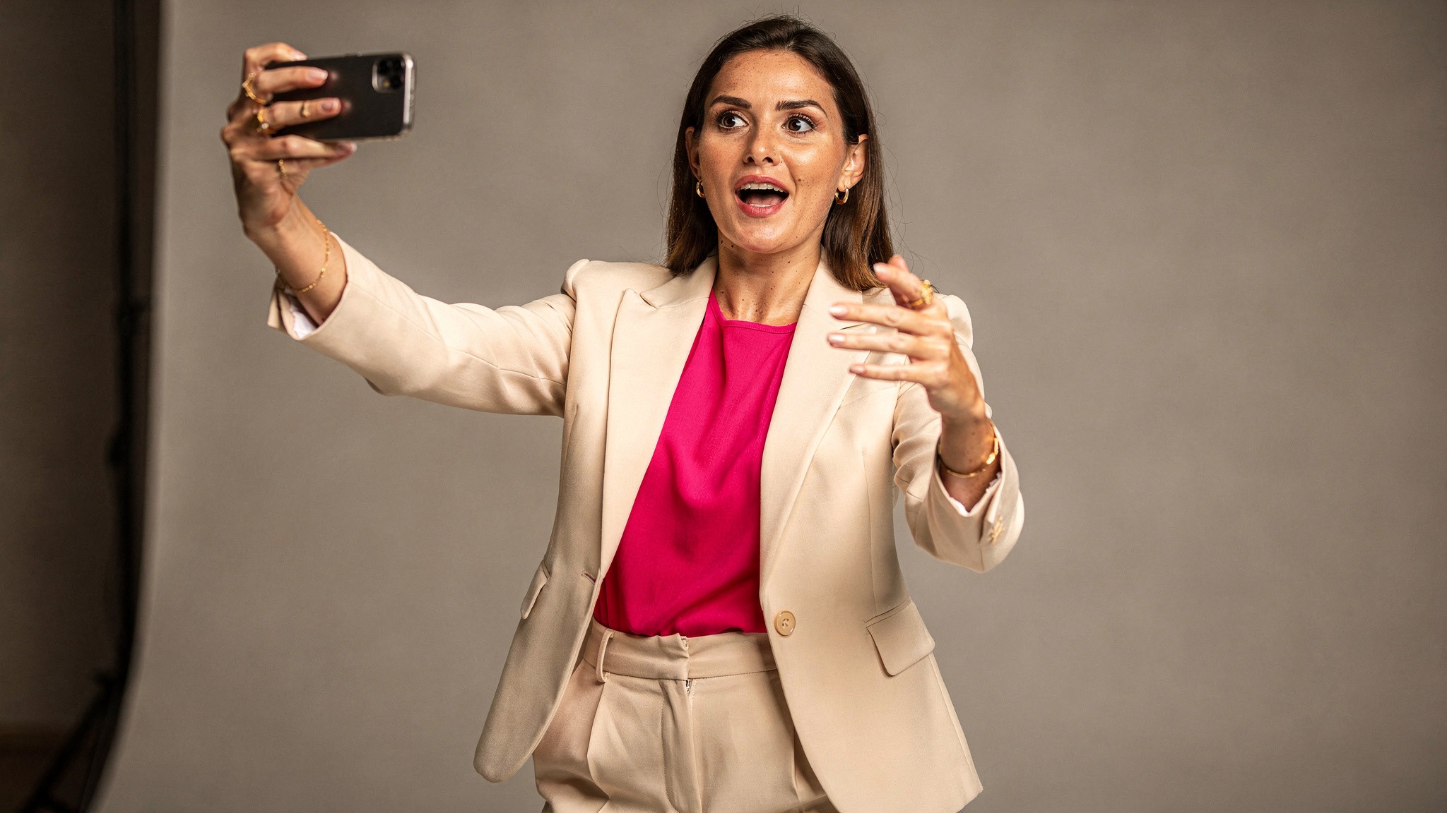 Creator filming herself mid-gesture delivering a punchy opening line