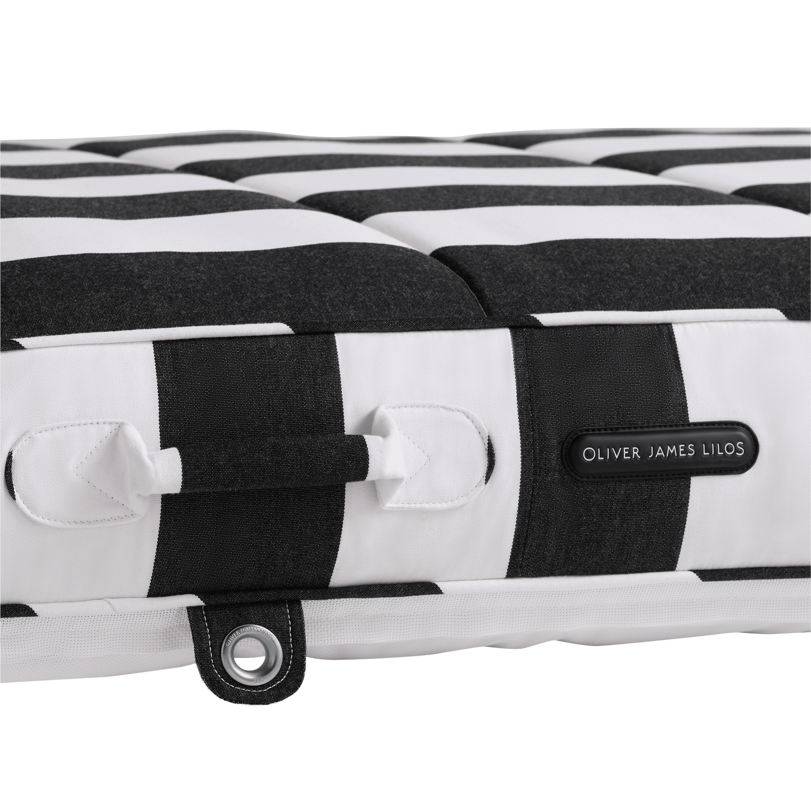 Close-up of a pool float showing black-and-white canvas handle, topstitched seams, and stainless eyelet