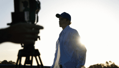 Alexander Jaxon poses during sunset wearing a William Maurice shirt