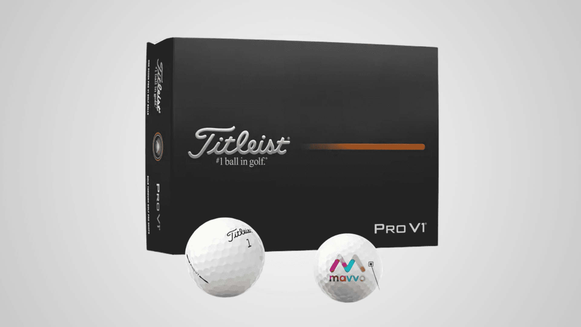 Tileist Golf balls one is blank and another is branded and placed infront of the box.
