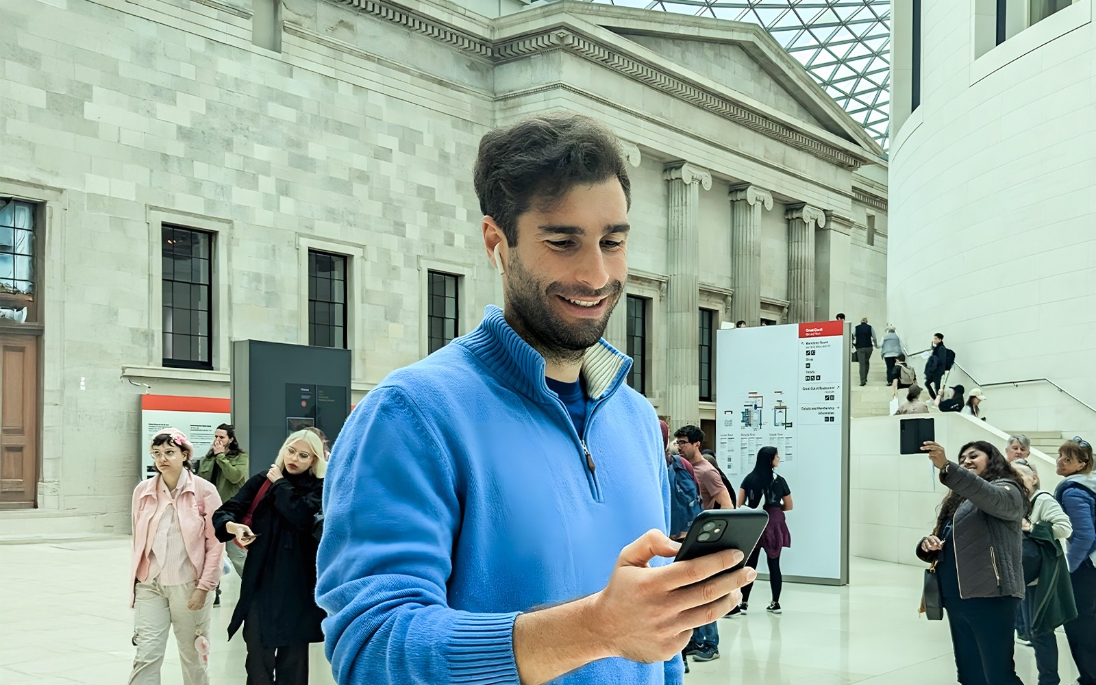 British Museum entrance with visitors, highlighting audio tour and priority access.