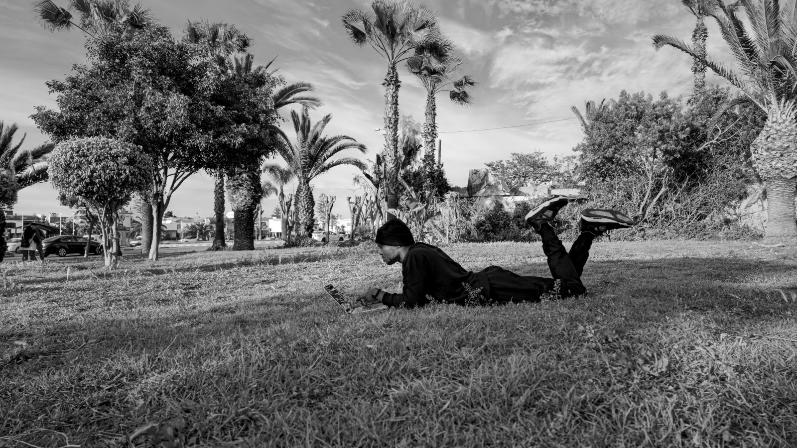 Samuel G. Sumo lying on grass