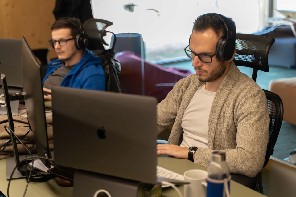 A busy customer support team working through the queue at their desks