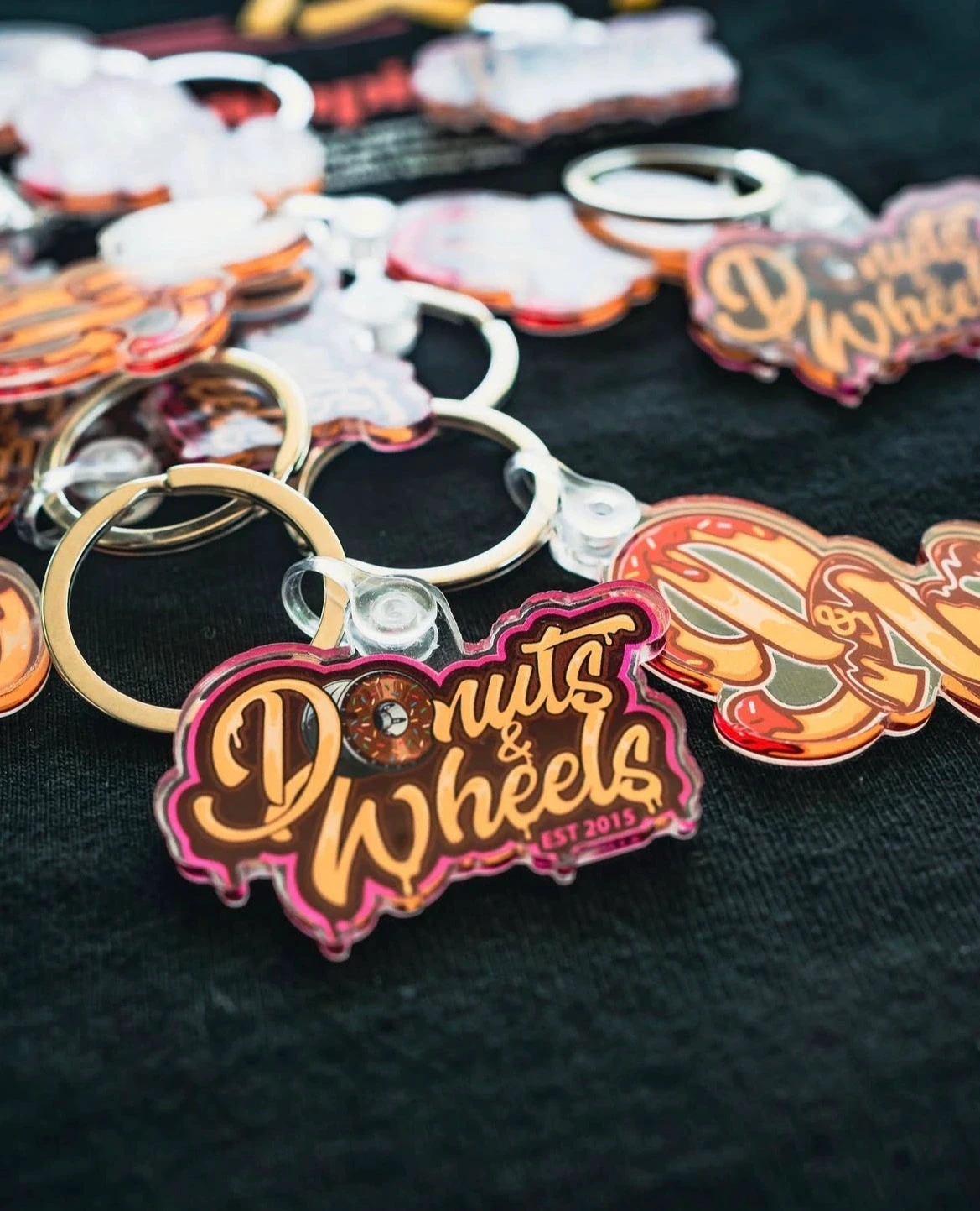 Donuts and wheels Logo design in a keychain by SLow Knife Design