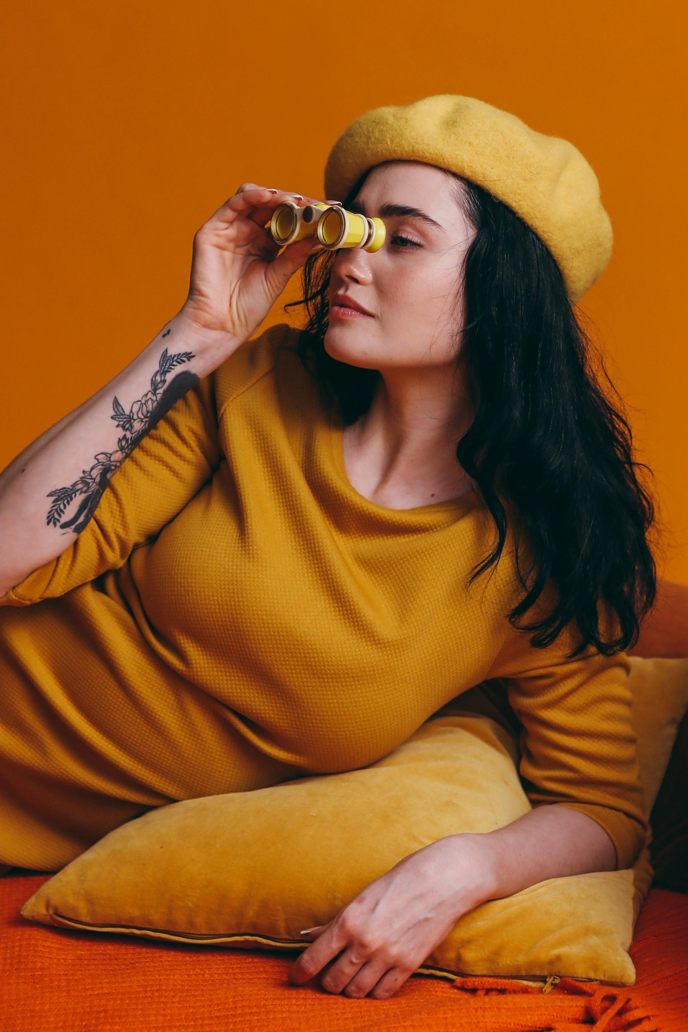 Woman looks through binoculars