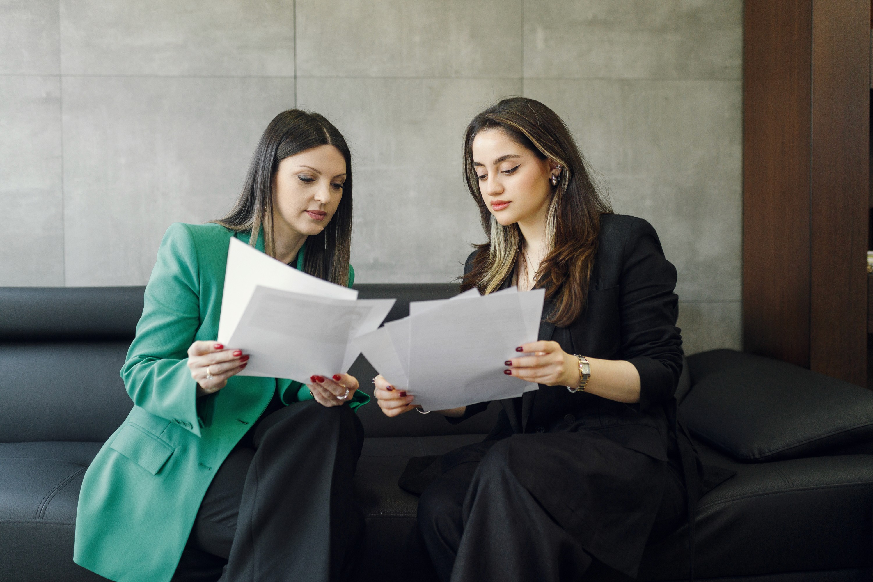 two girl looking pictures