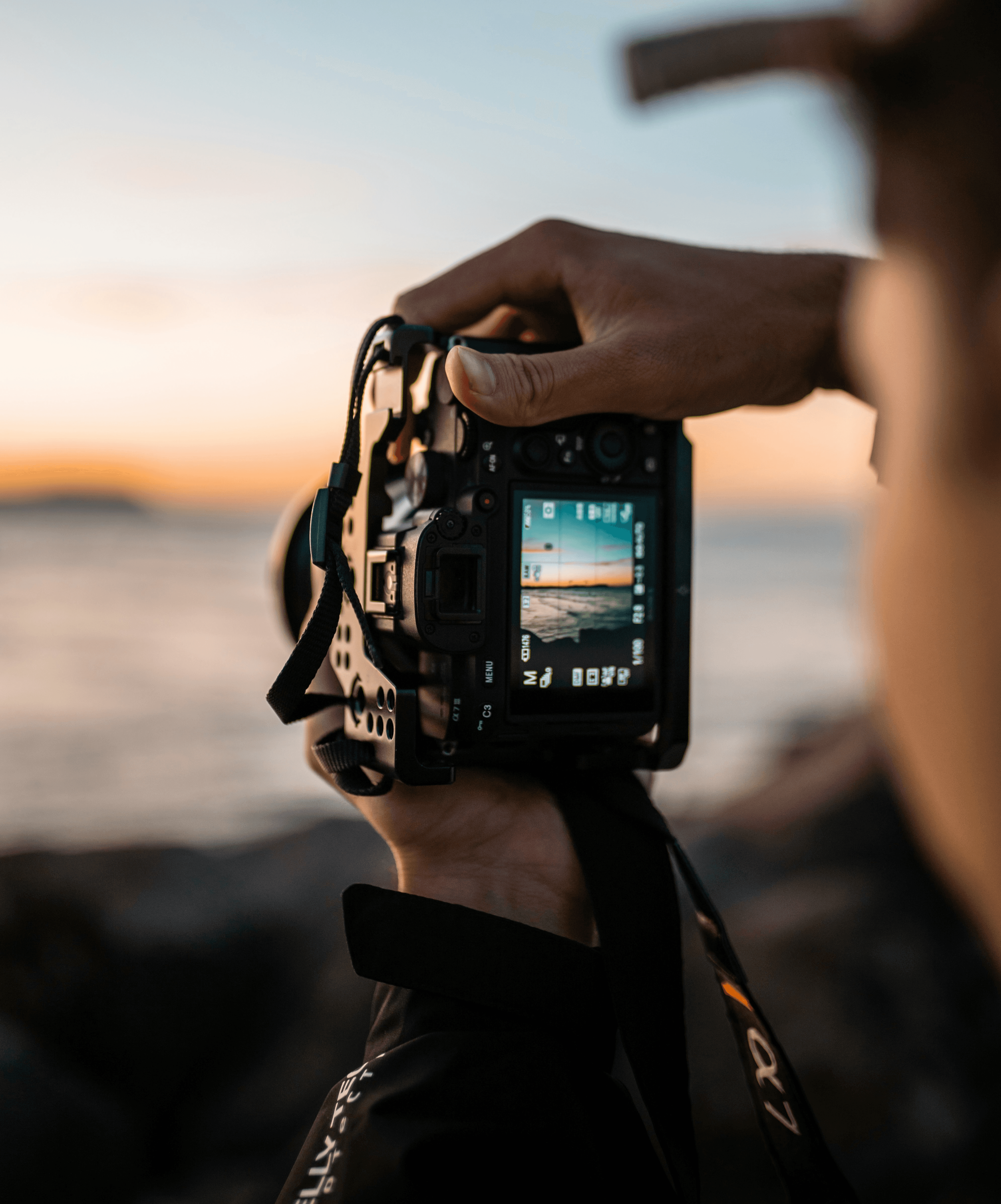 person holding black dslr camera