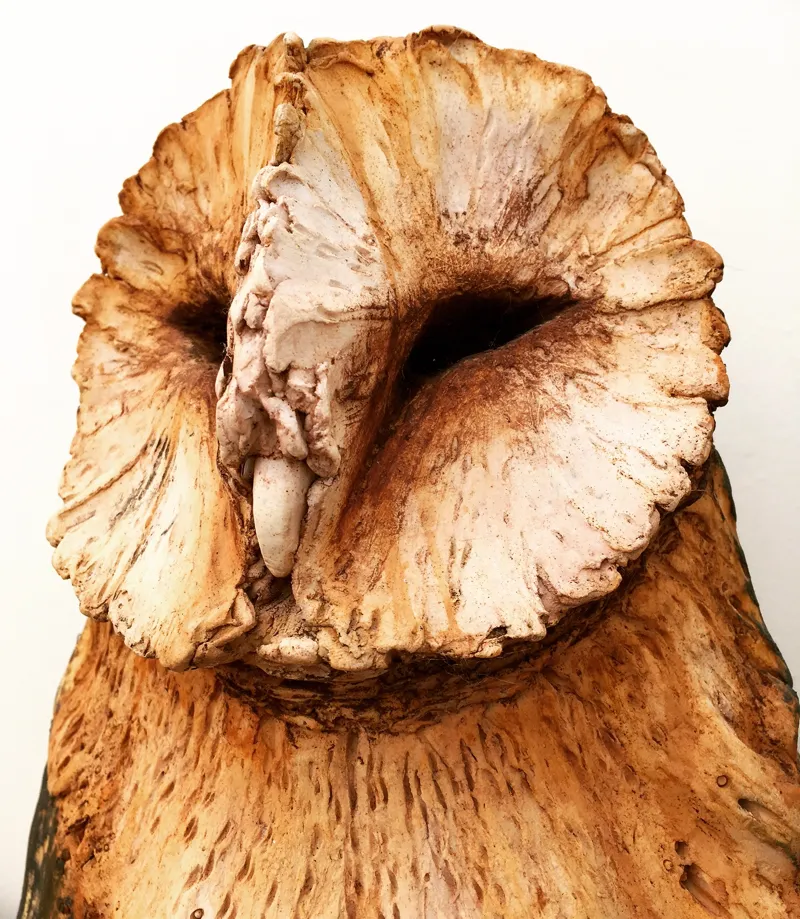 Owl posting sculpture close up