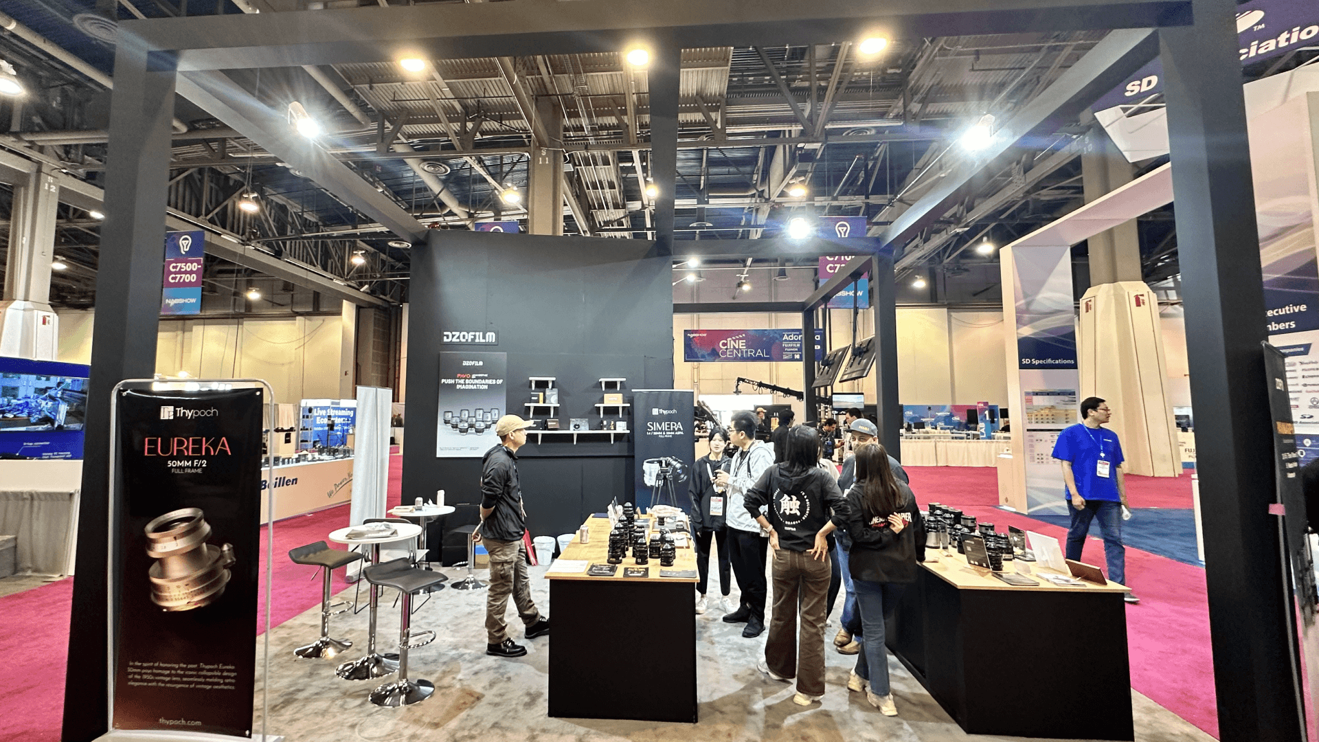 Chicago trade show booth installation sequence showing flooring, structure, utilities, graphics, AV, equipment displays, and final presentation with freight loading.