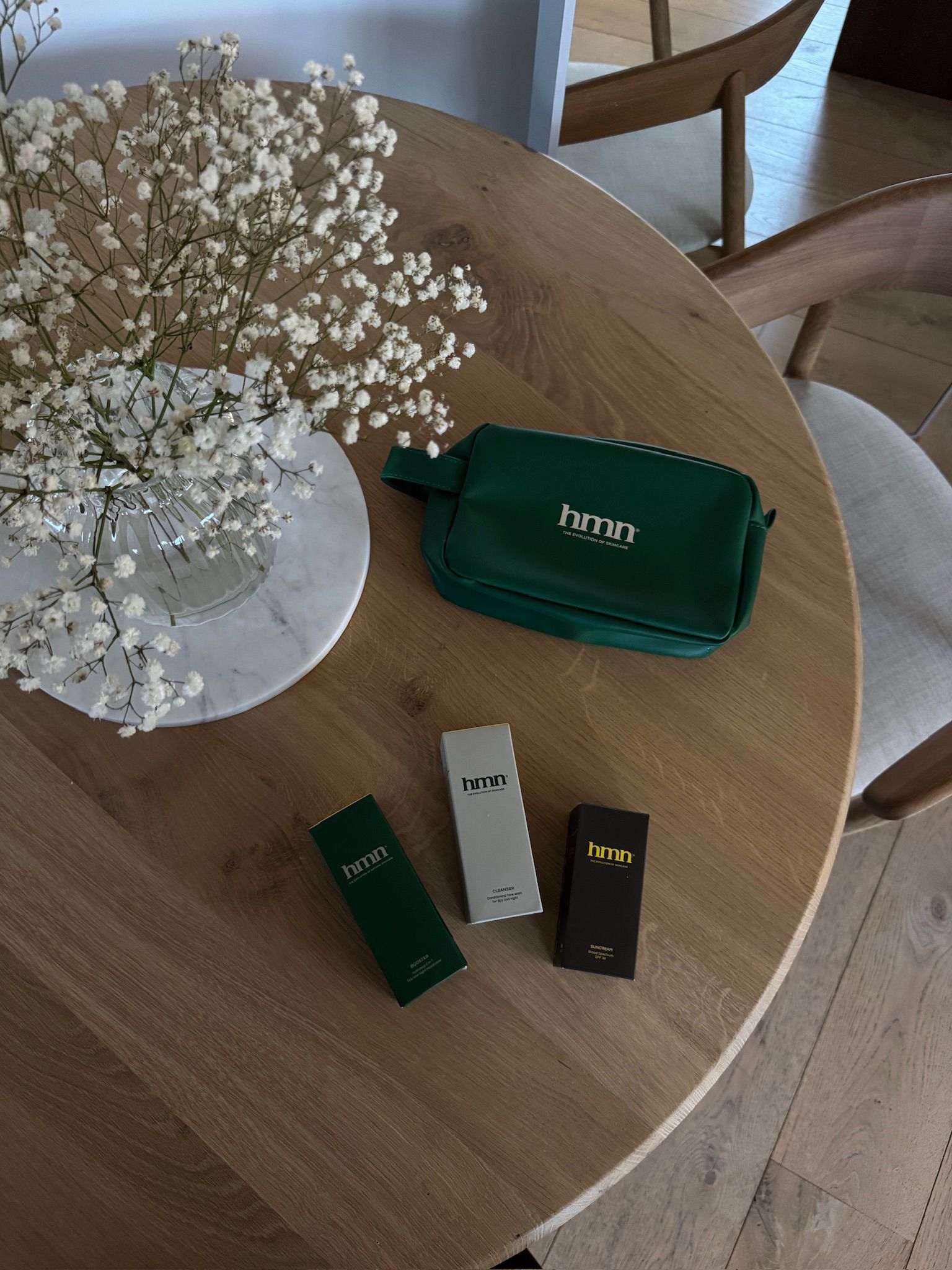 Streetside billboard with flyposters of the Batch.Works brand and illustrations