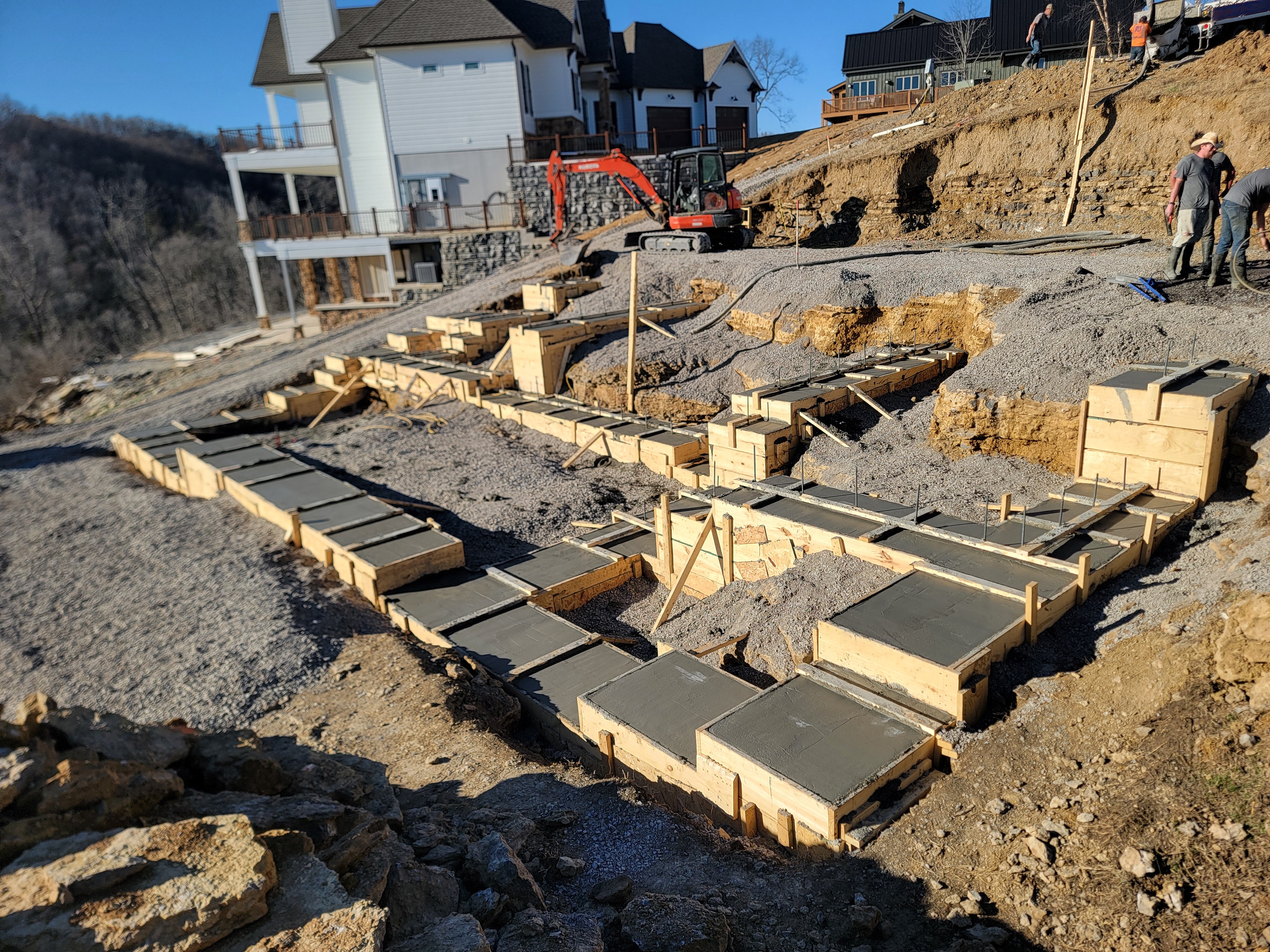 General contractor in Cookeville setting the concrete foundation of a home