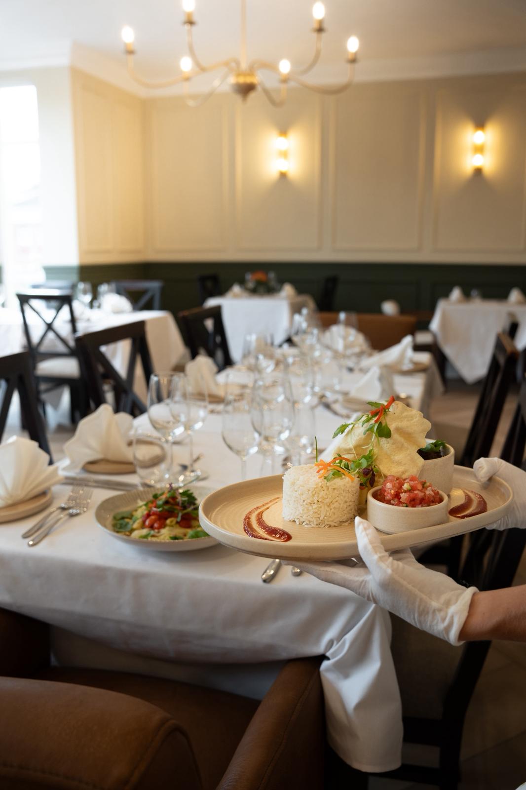 The wedding backdrop is the open sea, shimmering under late afternoon light