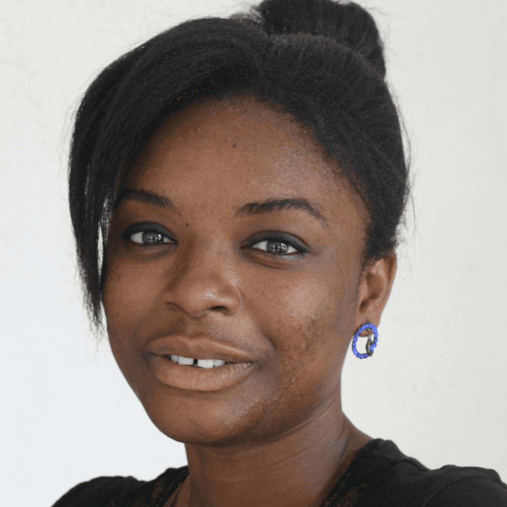 a man with a goatee smiles at the camera