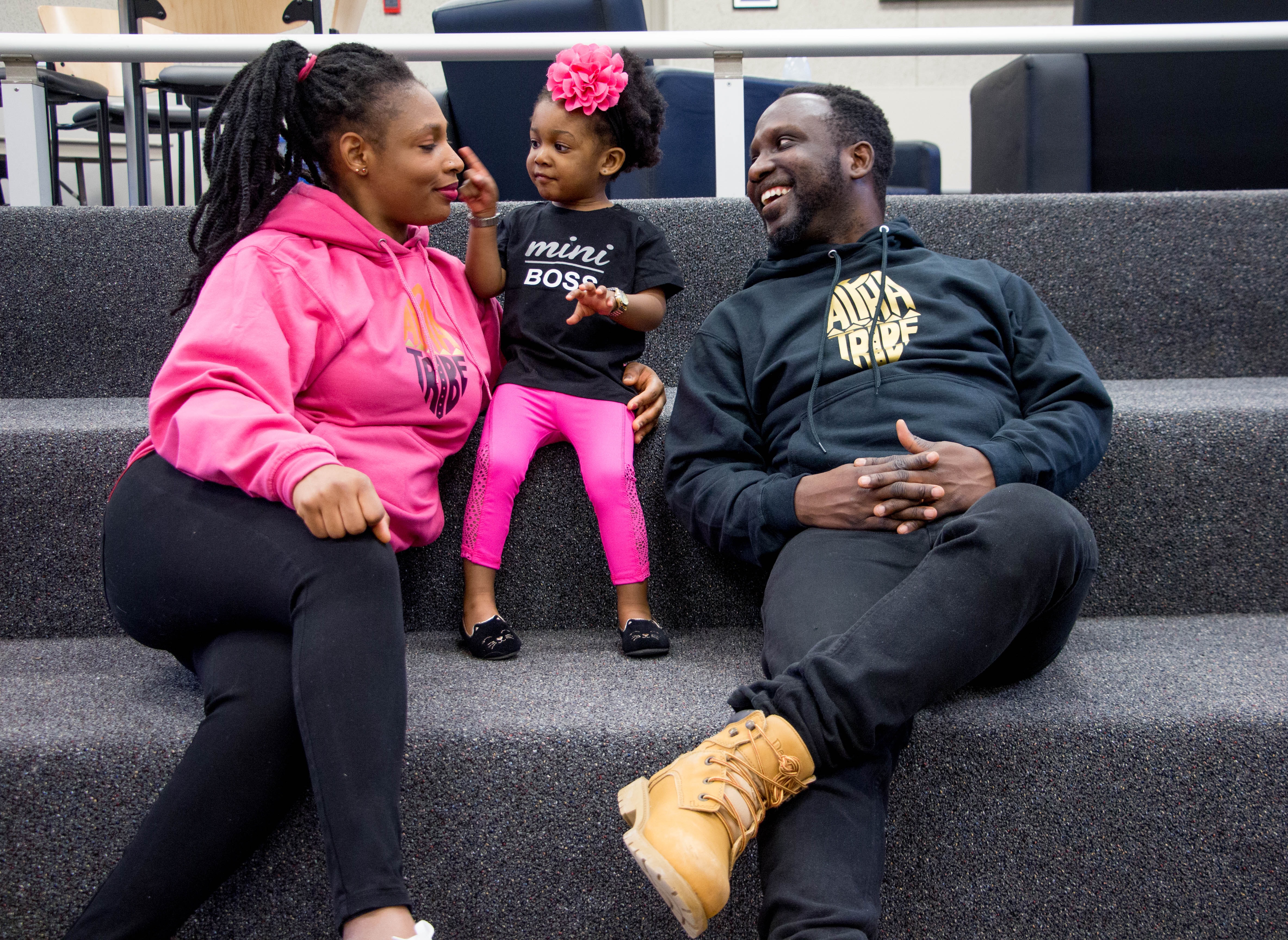 (left to right) mom, little girl, dad