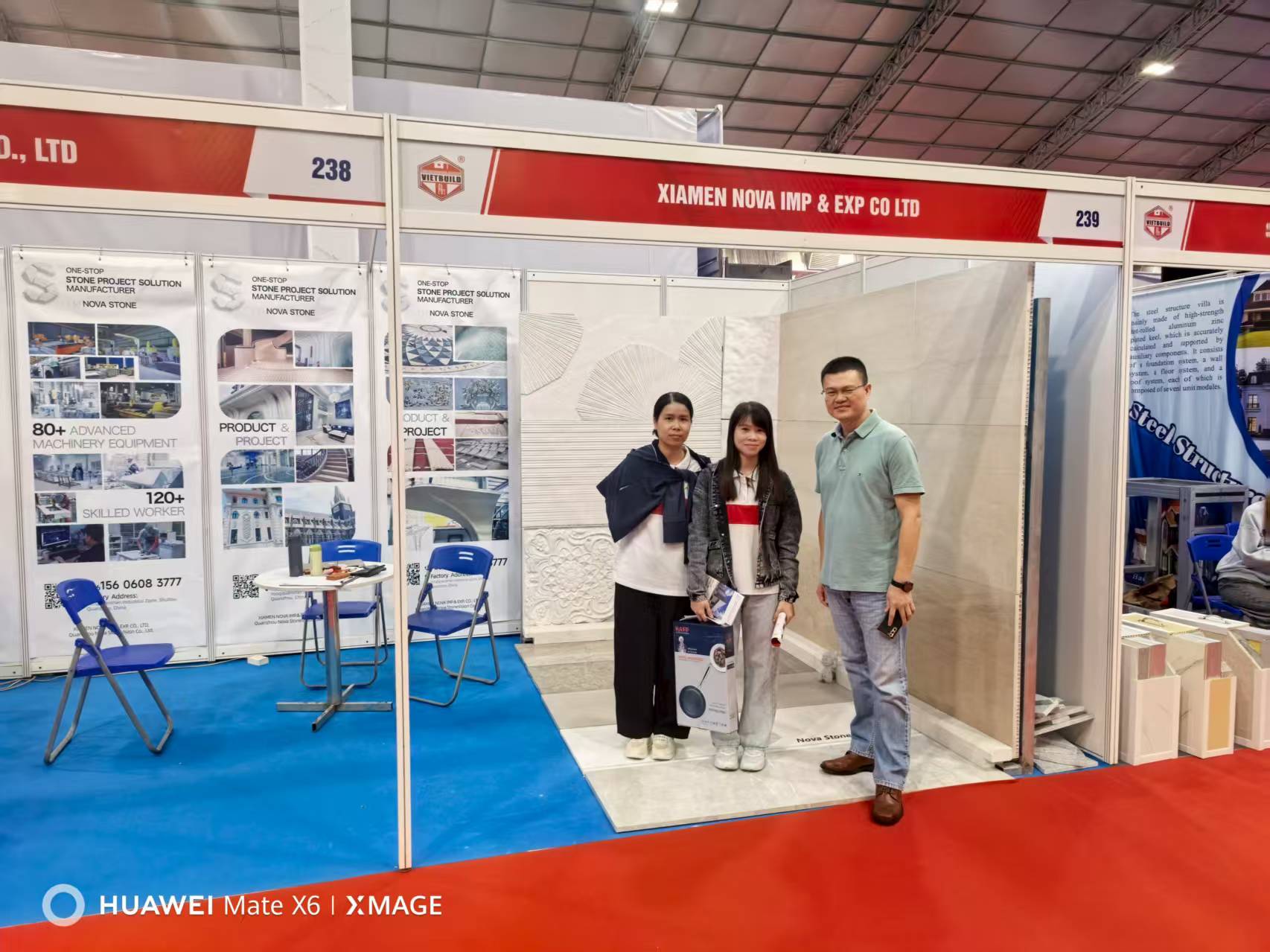 Nova Stone team meeting with international clients at Vietnam trade show.