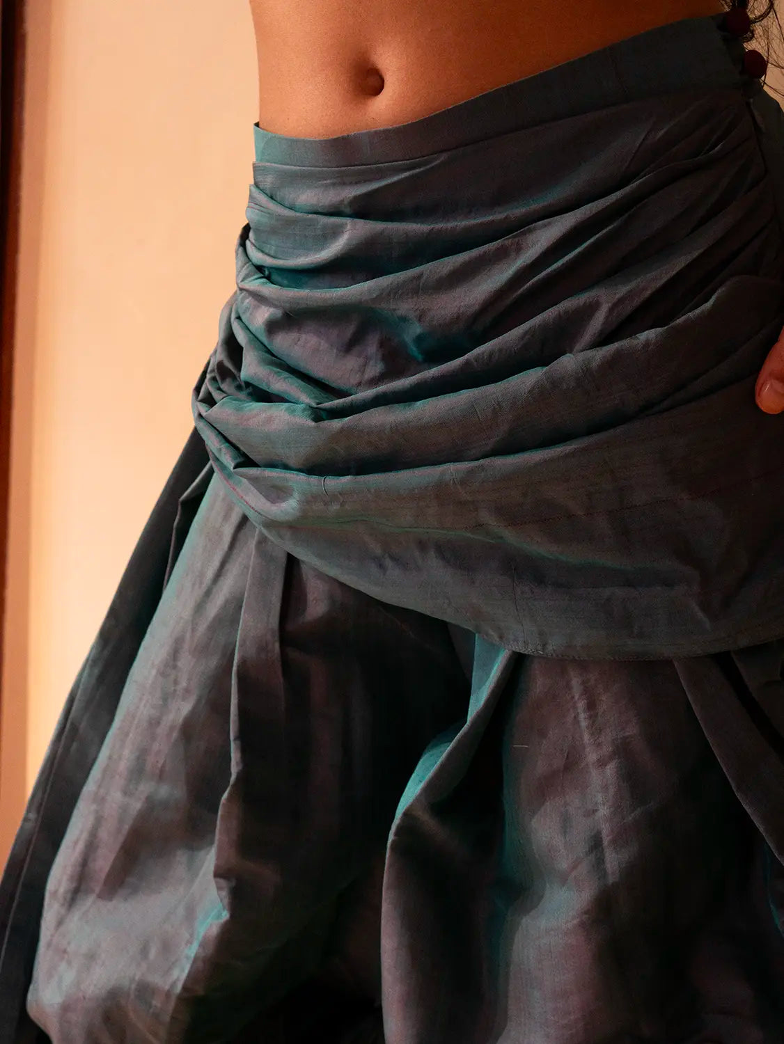 Antariya is a one of a kind drape pant, handcrafted in house from repurposed pure silk and saree borders. 