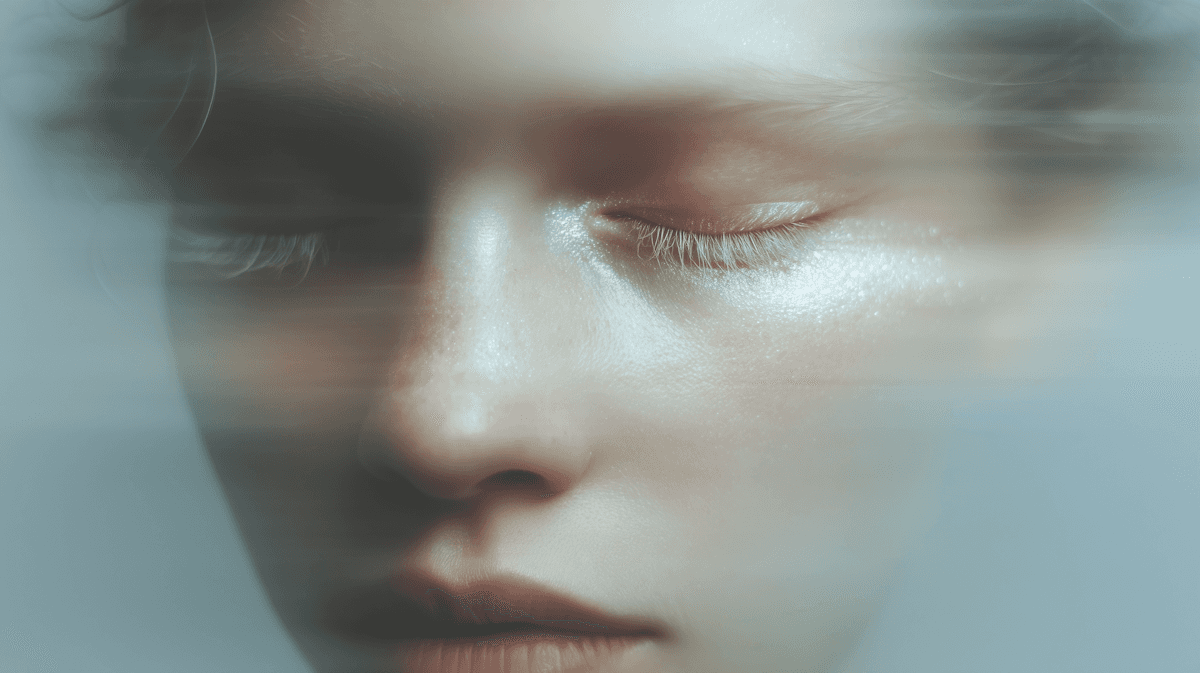Dreamy close-up of a serene face with closed eyes, soft lighting, and blurred edges, evoking a sense of peace and introspection.