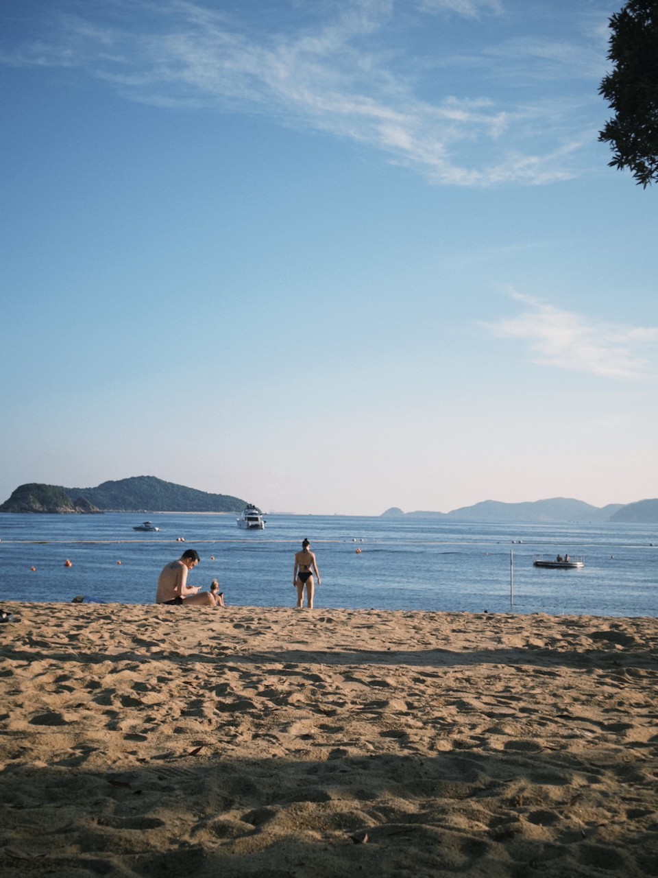 people enjoying the sun and the sea on the beach