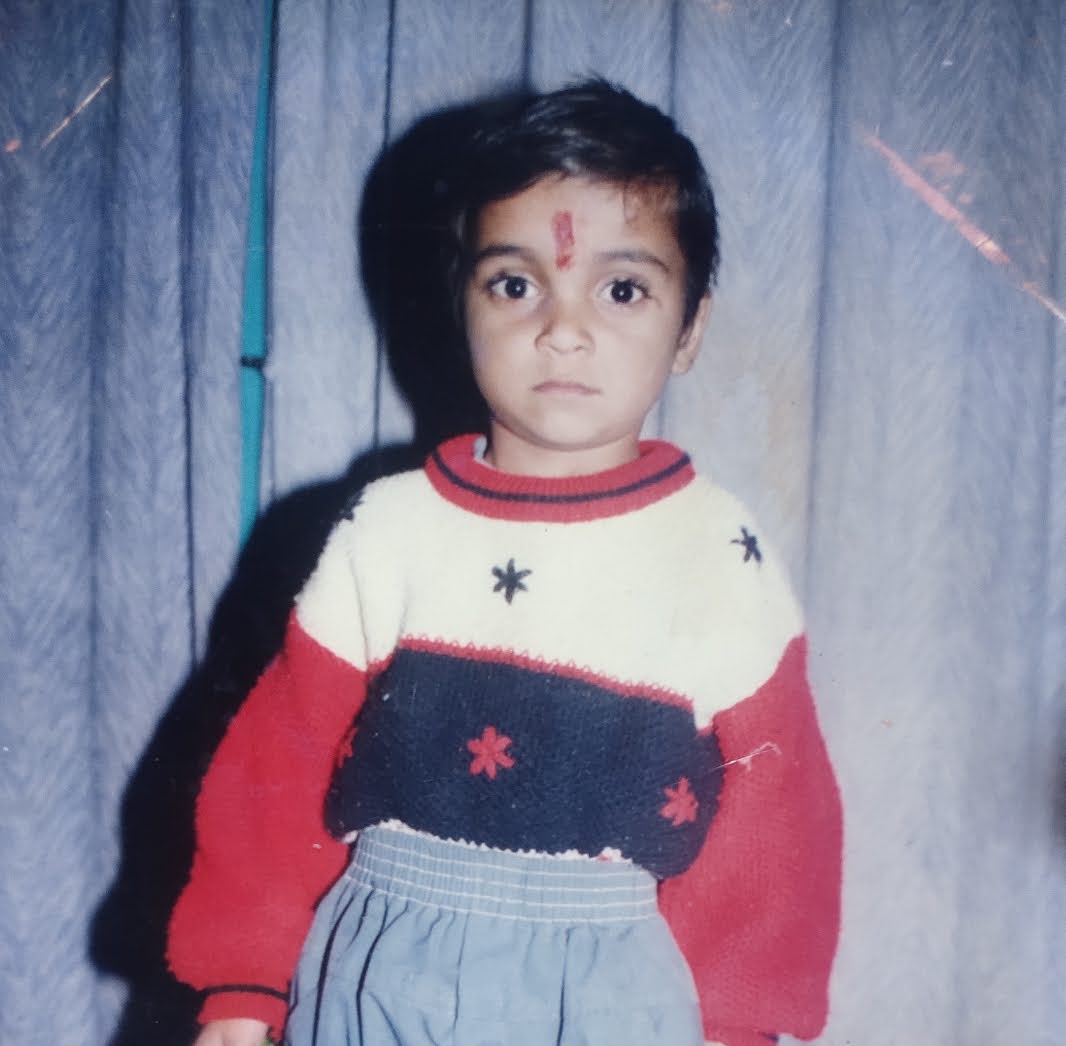 a group of people standing on top of a sandy beach