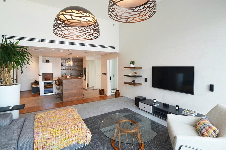 Modern open-plan living room and kitchen in a premium Silverene Tower residence.