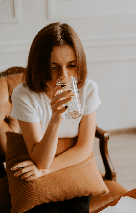 a woman holding a glass