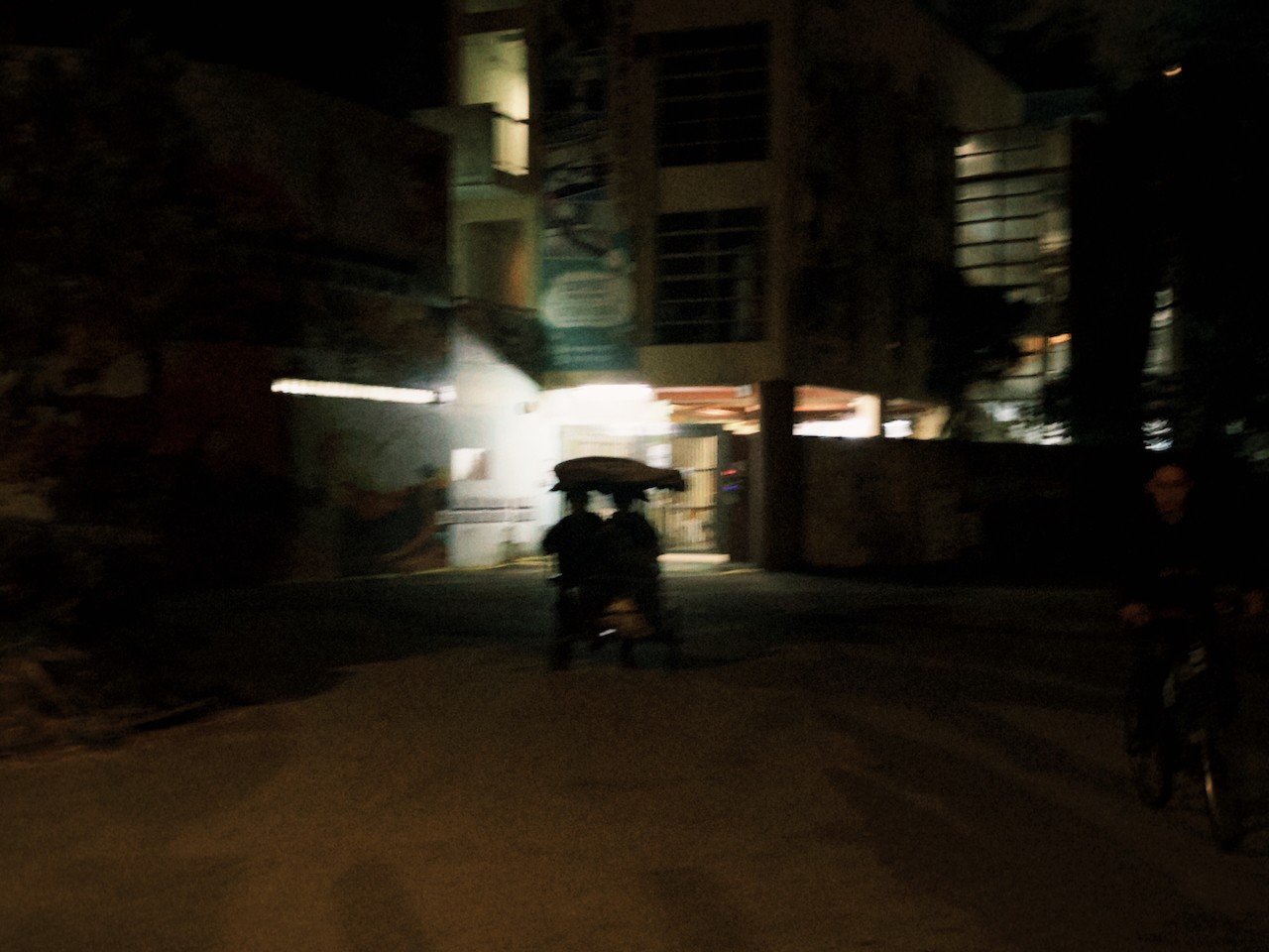 two boys riding a bicycle together