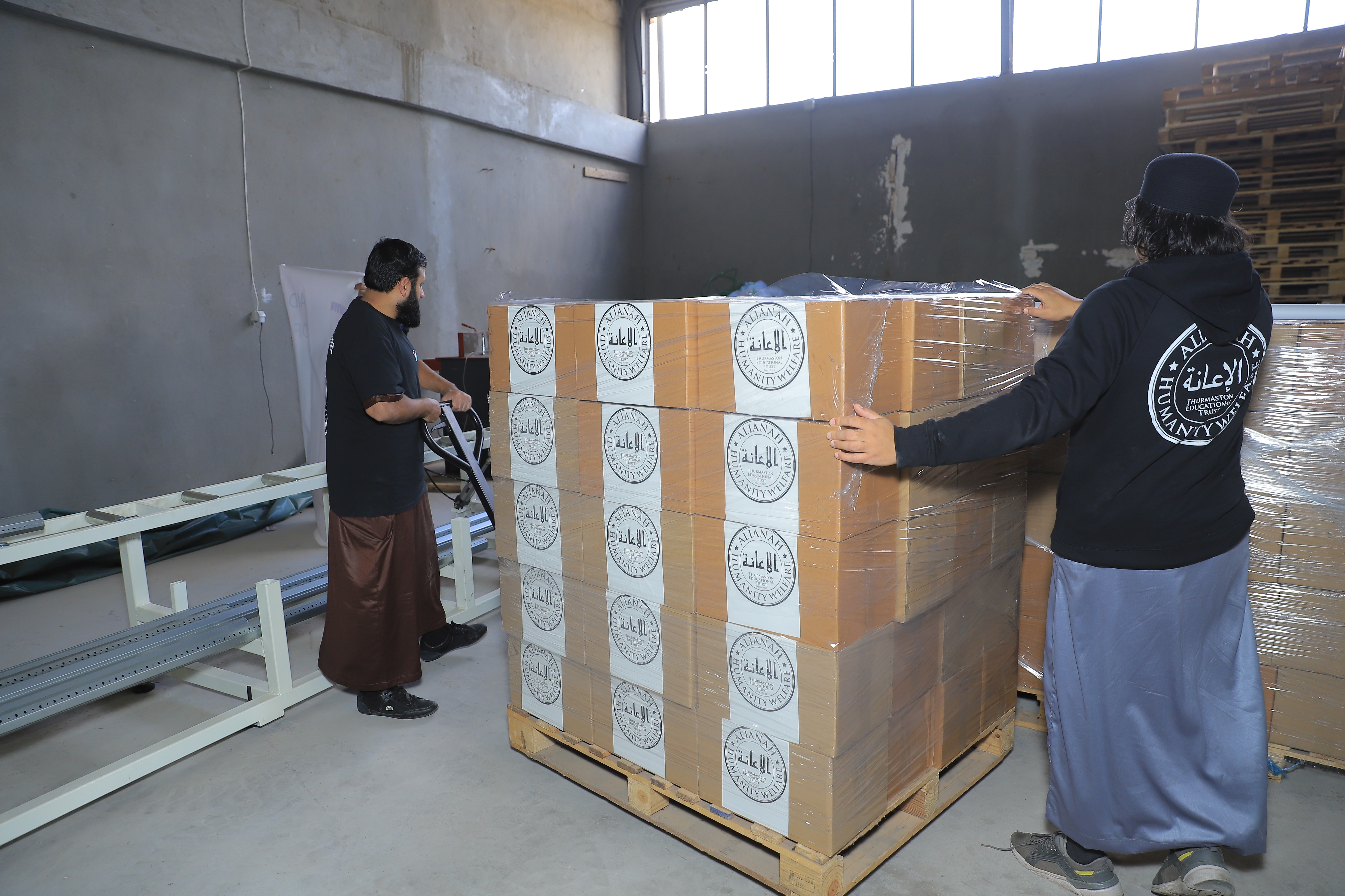 a group of children sitting on steps in front of a building