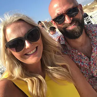 a man and a woman wearing sunglasses in summer