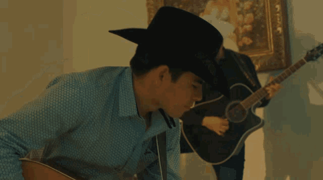 Jose Manuel and Friend Playing Guitars