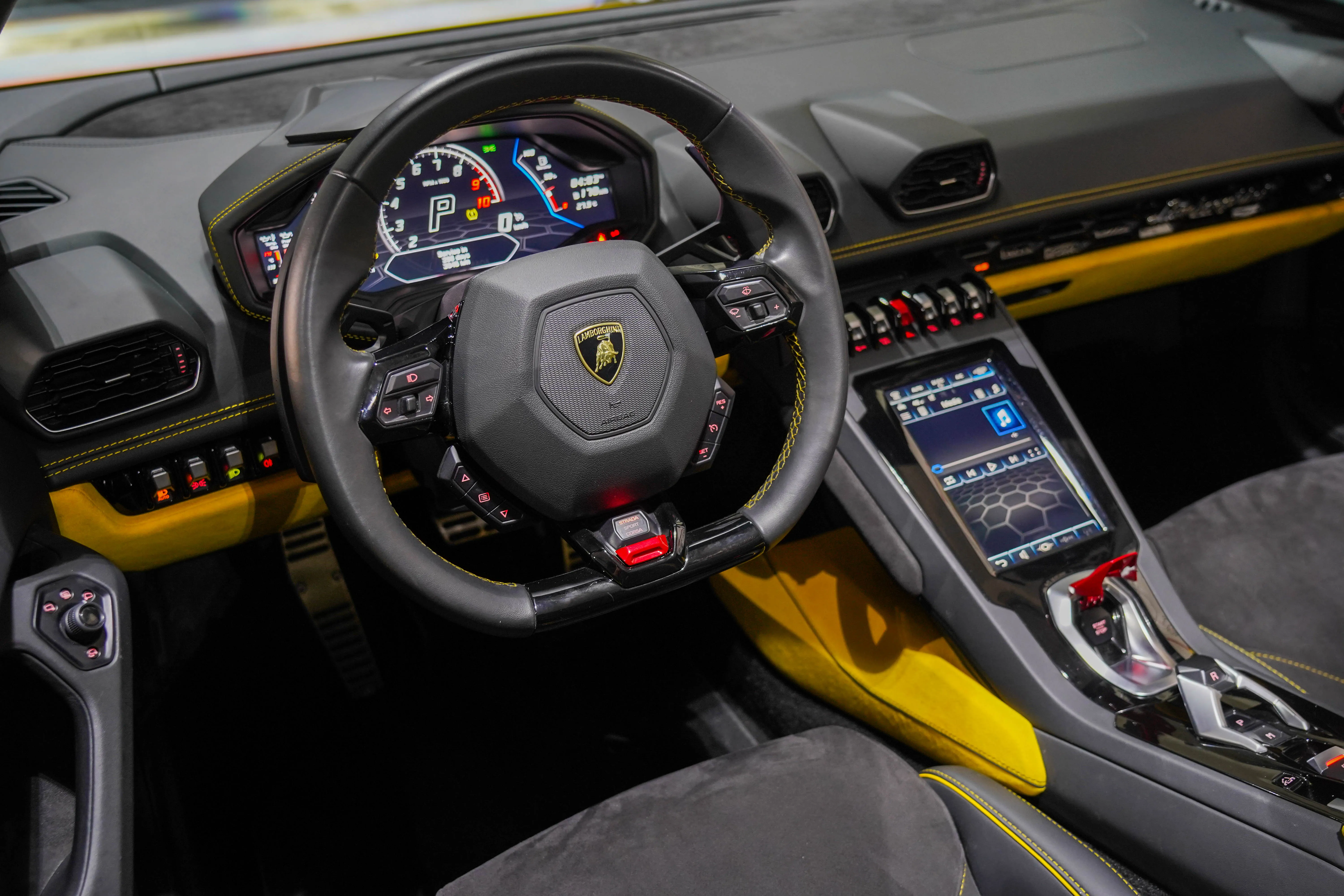 Lamborghini Huracán interior cockpit with steering wheel – exotic car rental experience Dubai