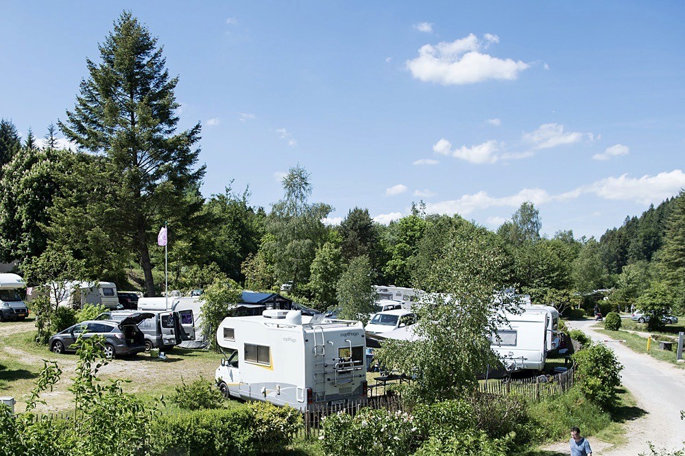 Caravans and mobile homes at the campsite with blue sky