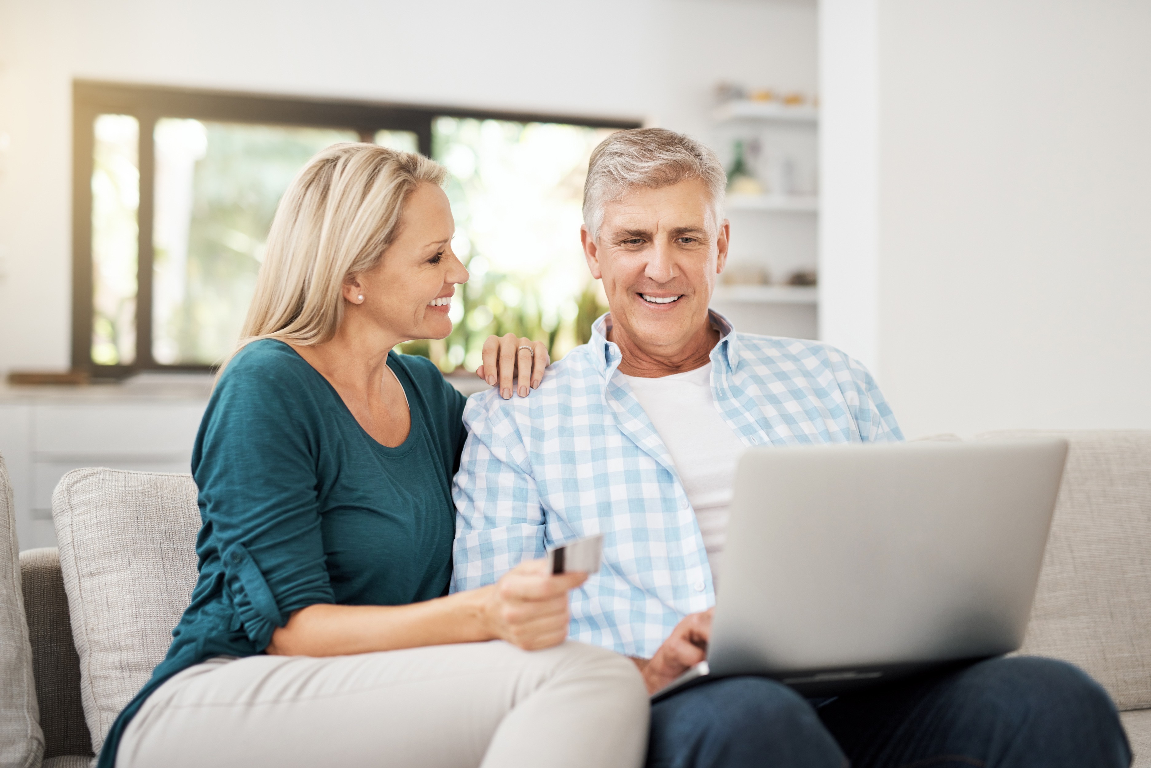 middle age couple people laptop looking at finances home loan refinancing