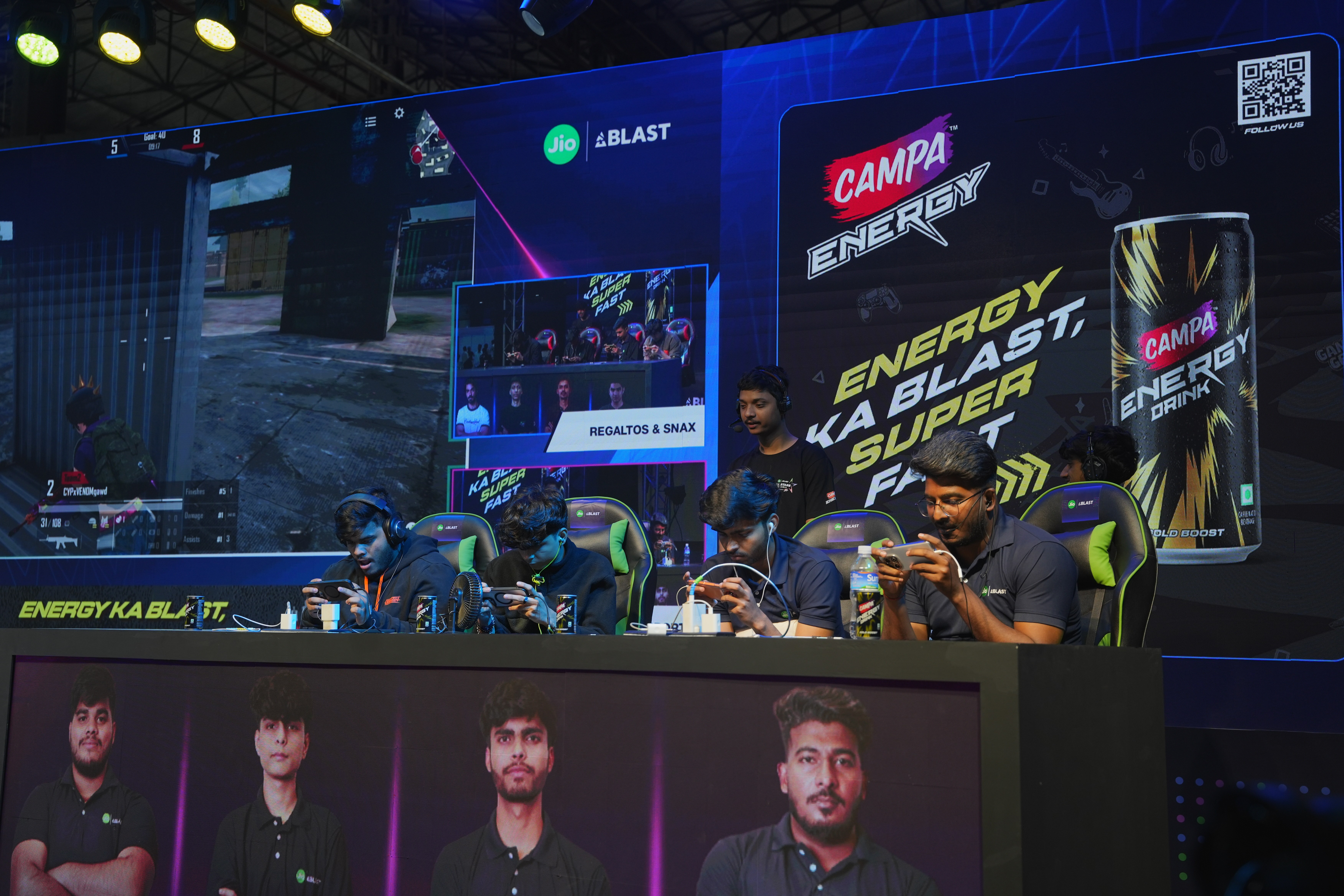 Blue banners with team logos at an esports event