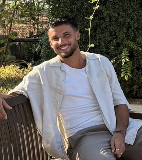 woman in black long sleeve shirt sitting on white couch