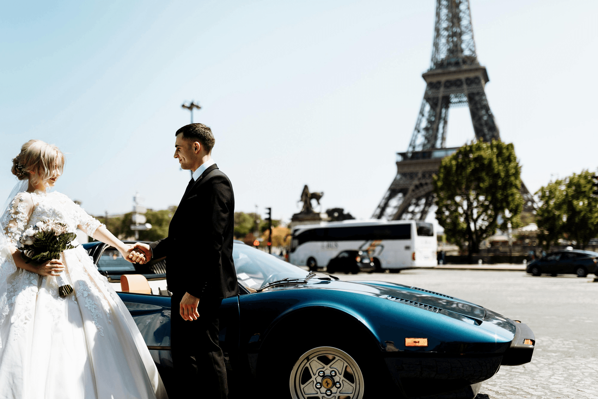 bride and groom outside car