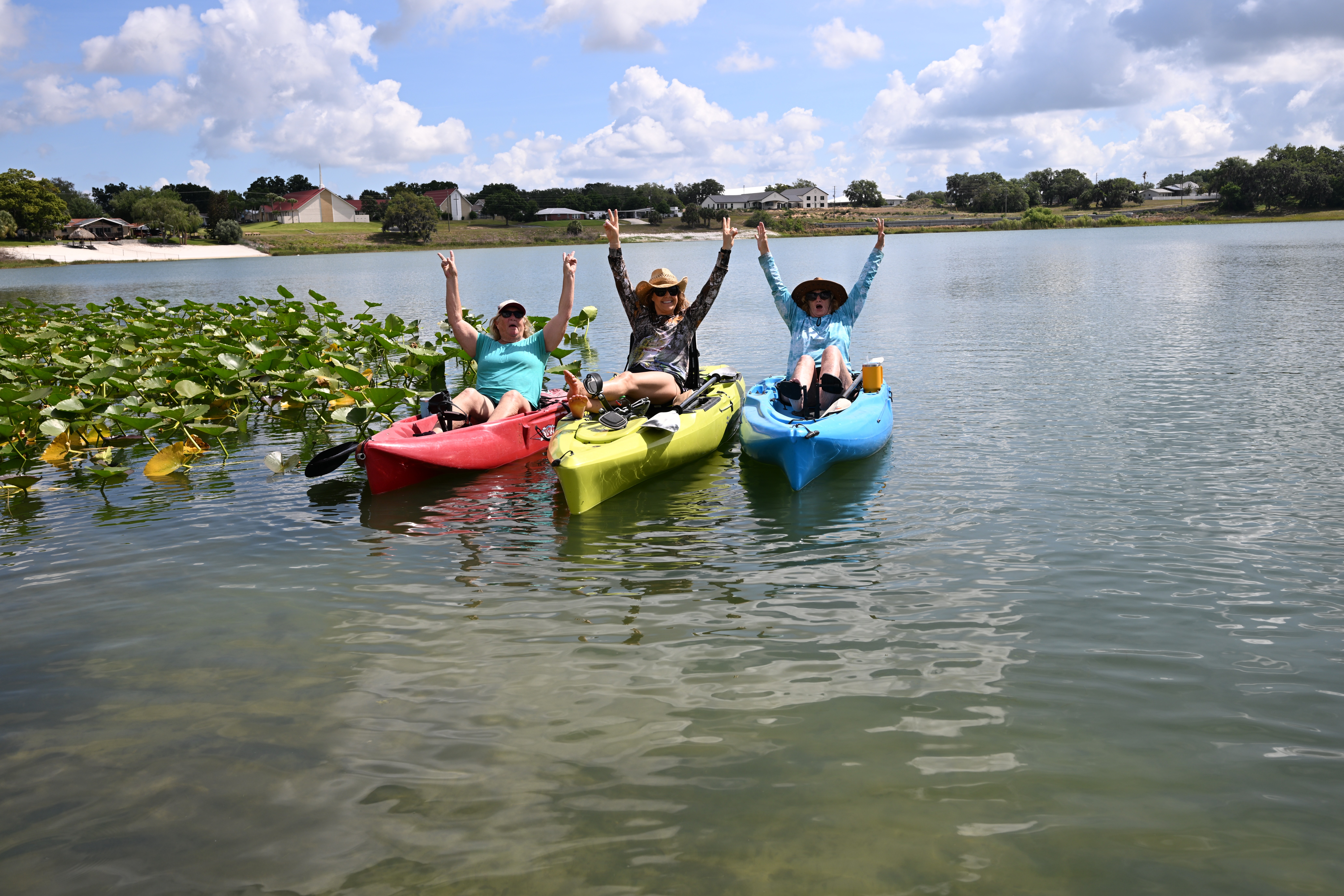 Three women having fun on kayaks
