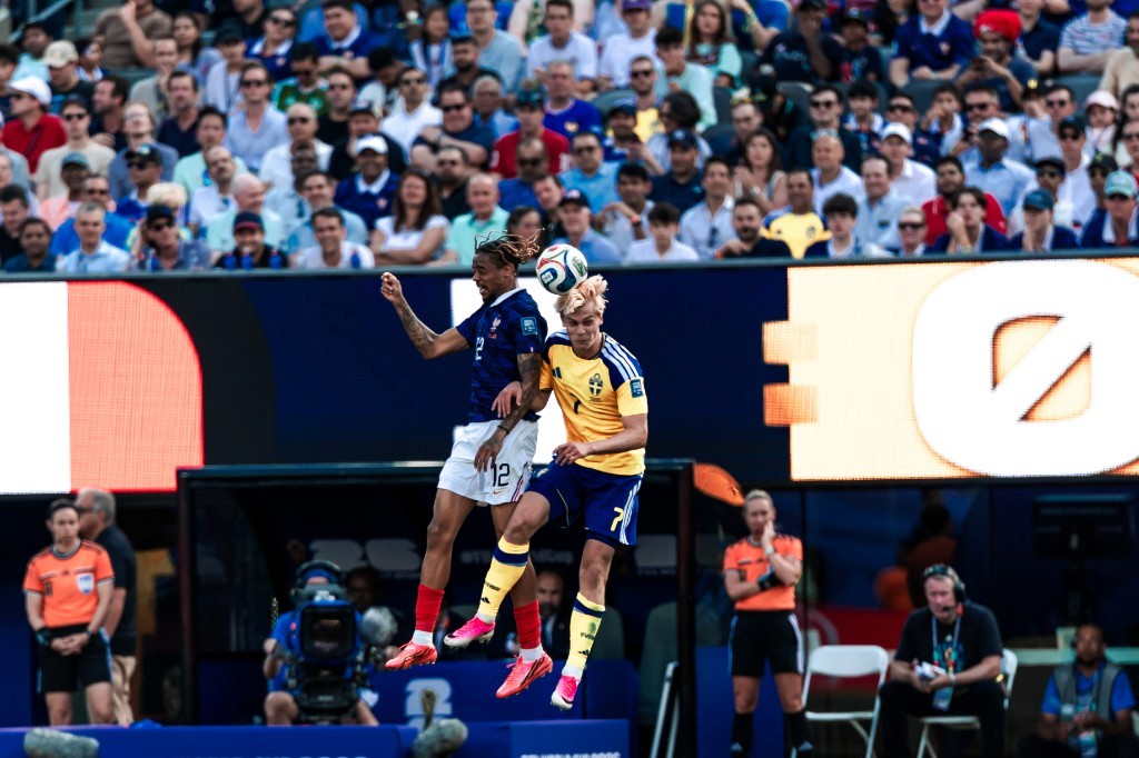 France and Sweden players leap for a header during their 2026 FIFA World Cup Round of 32 match