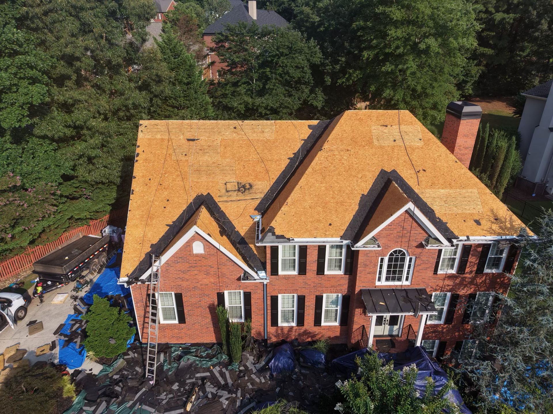 Roof decking exposed and checked during a roof replacement in Alpharetta, GA