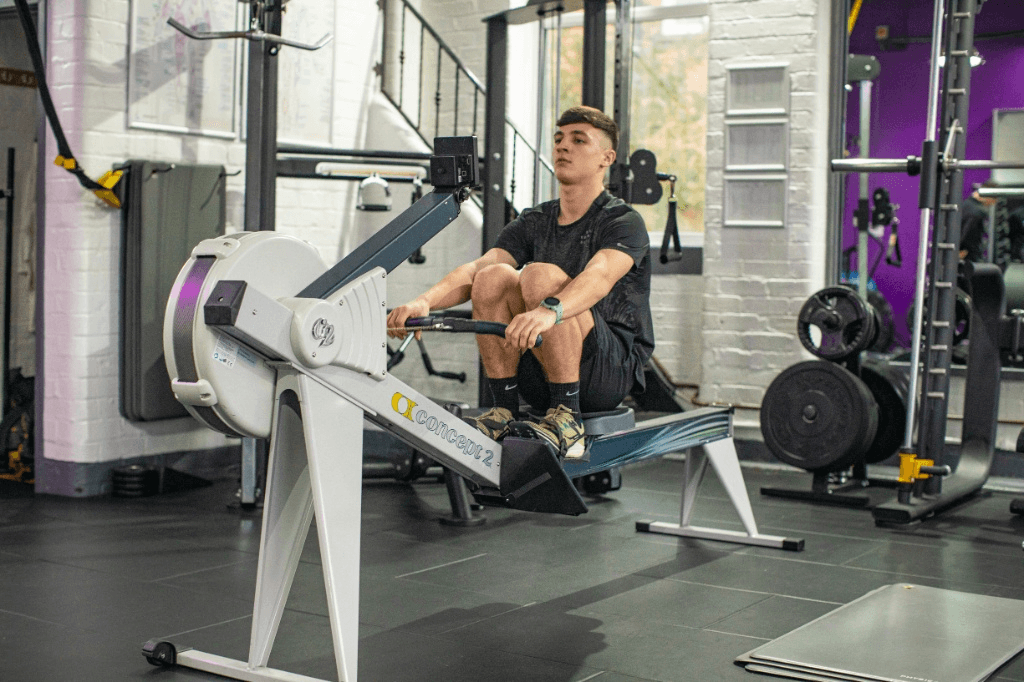 Using a rowing machine as part of a structured fitness plan to prevent weight gain.