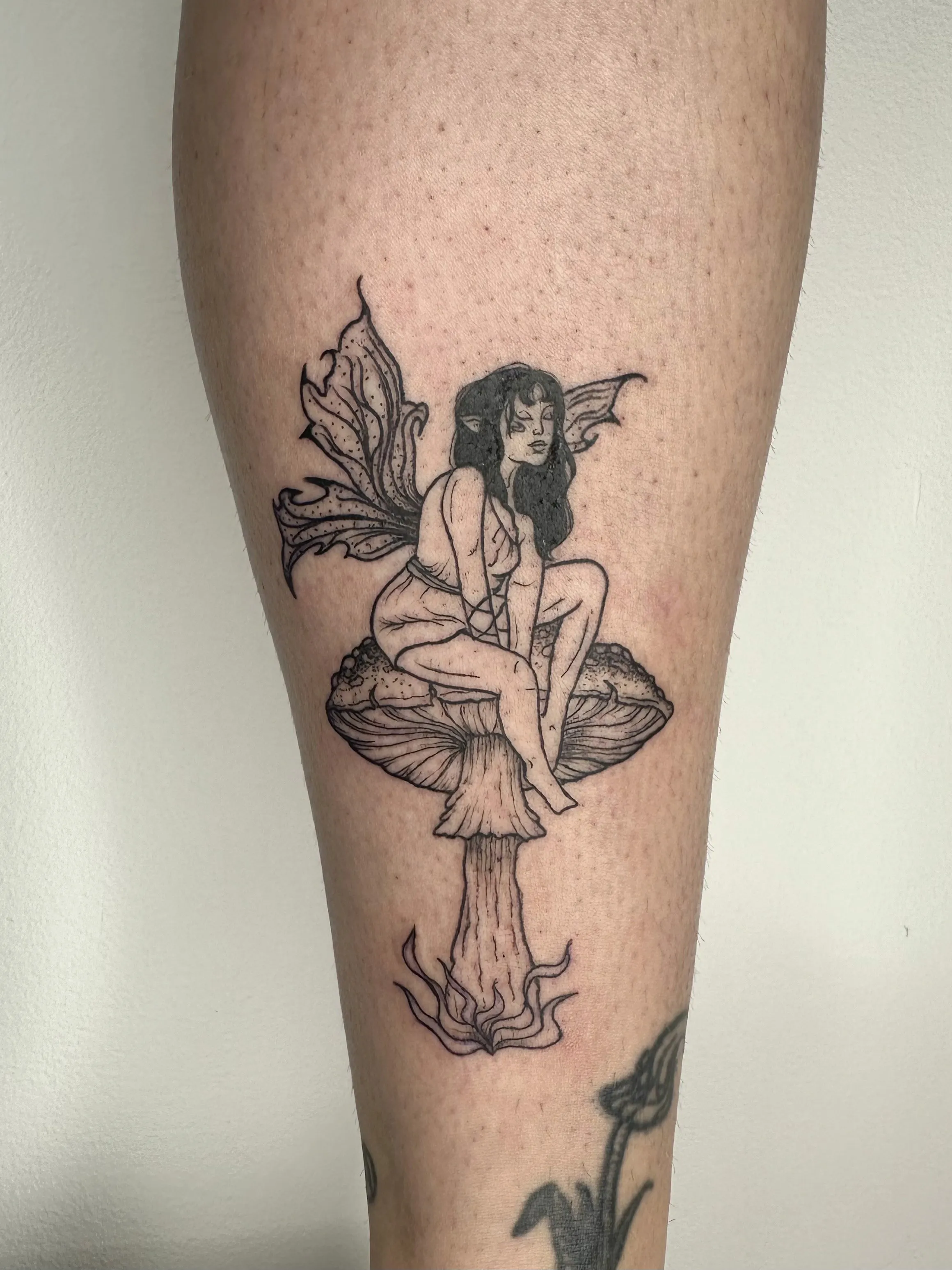 Playful Graphic Linework Fairy Tattoo by Artist Sandra