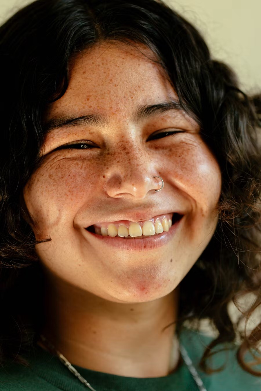a close up of a person with a smile on her face