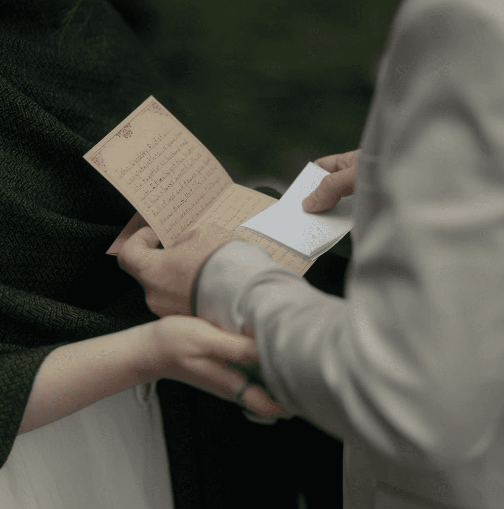 elopement ceremony couple reading family letters