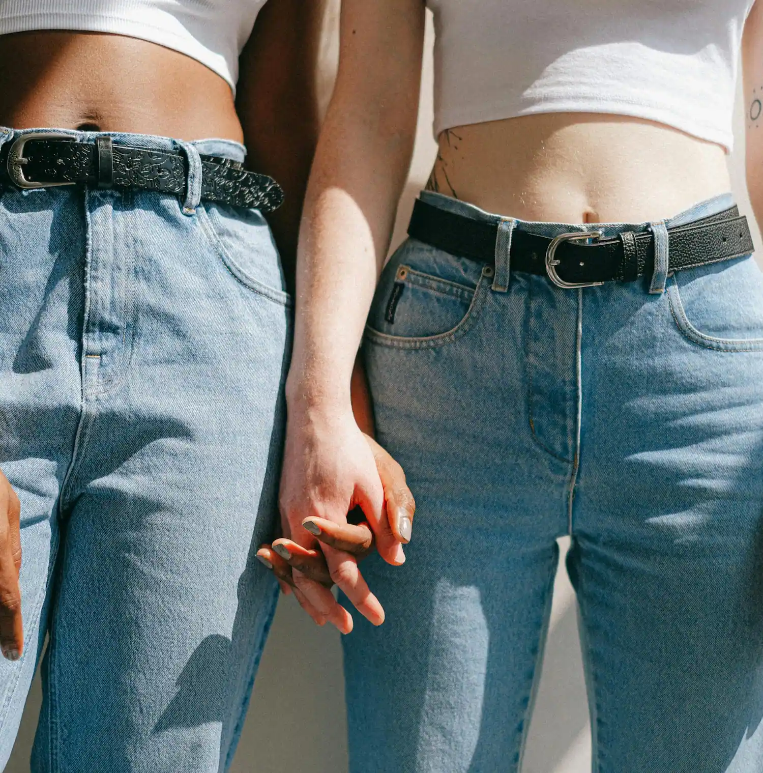 Two women holding hands, symbolizing connection, trust, and support in lesbian affirming therapy in Los Angeles.