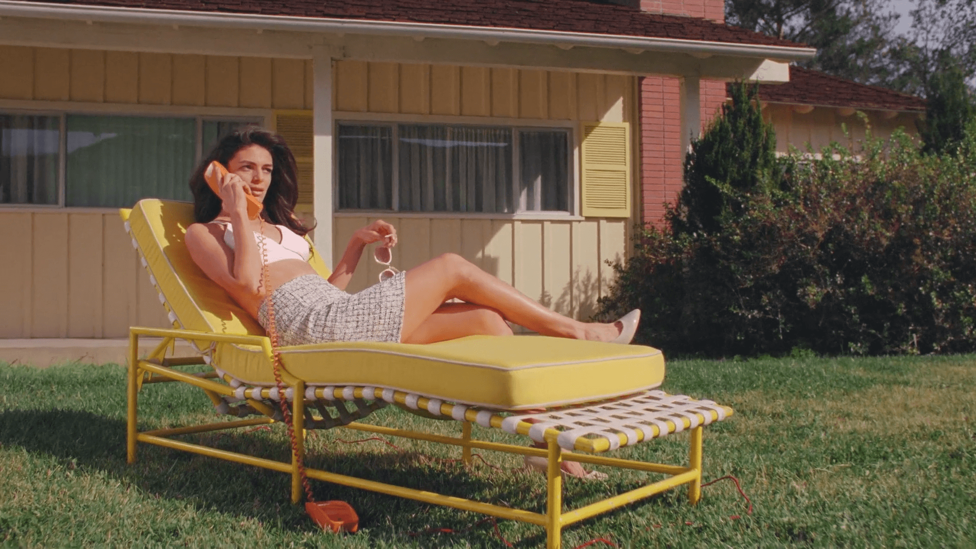 A person walks down a dimly lit alley at night.