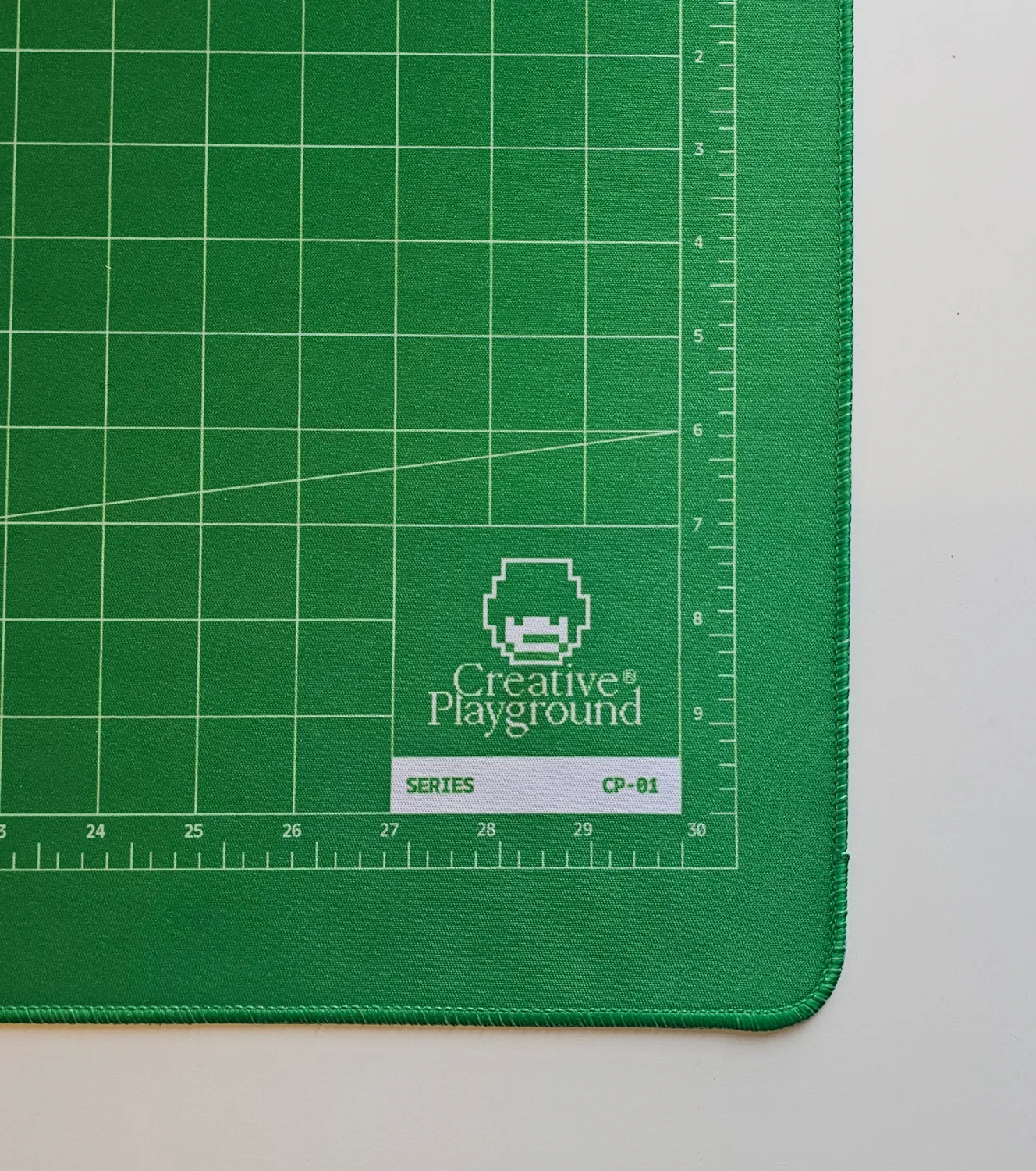 Close-up of the printed Series CP-01 tag on the green mat