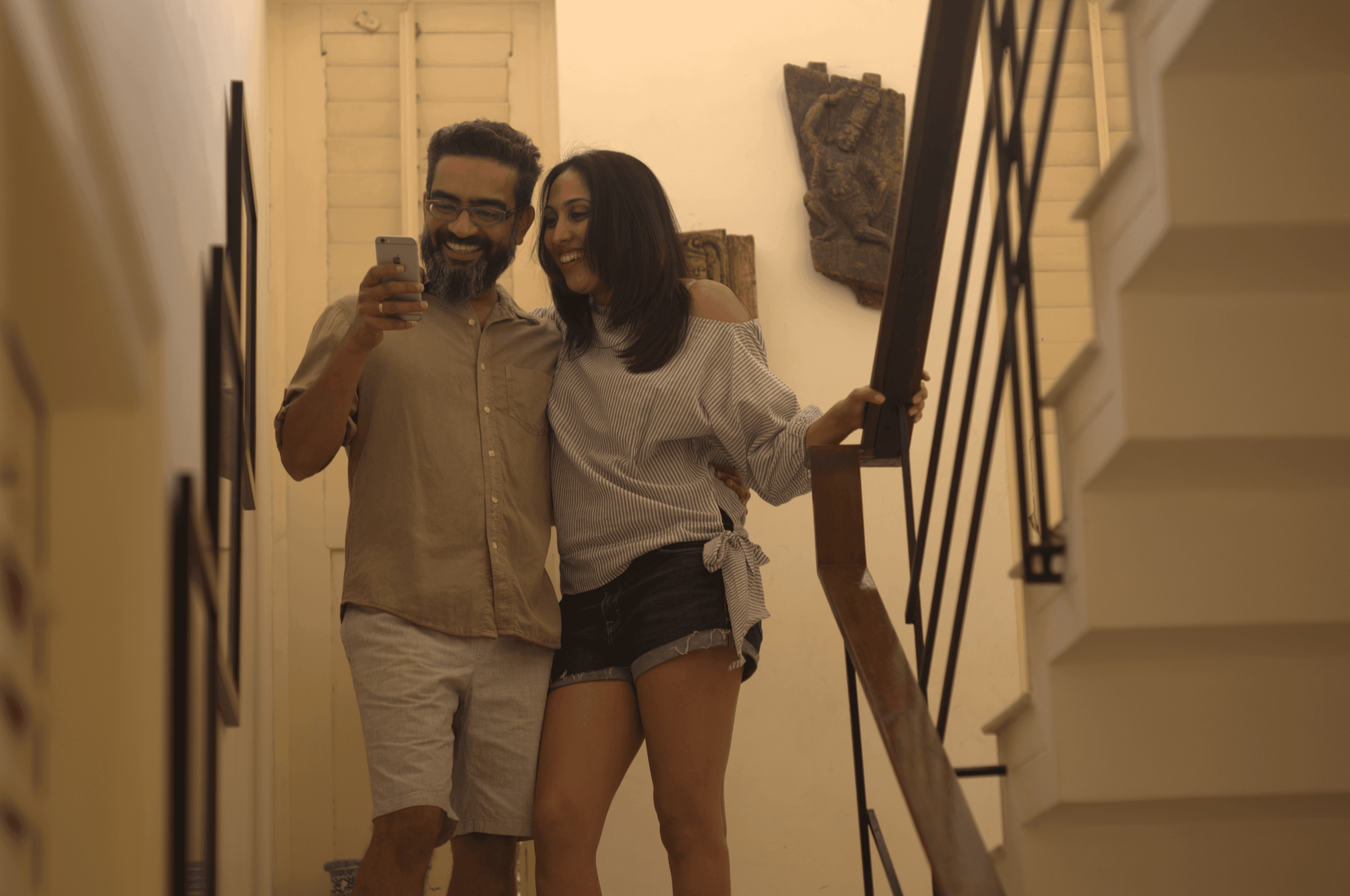 A beautifully decorated wedding cake featuring red and white roses.