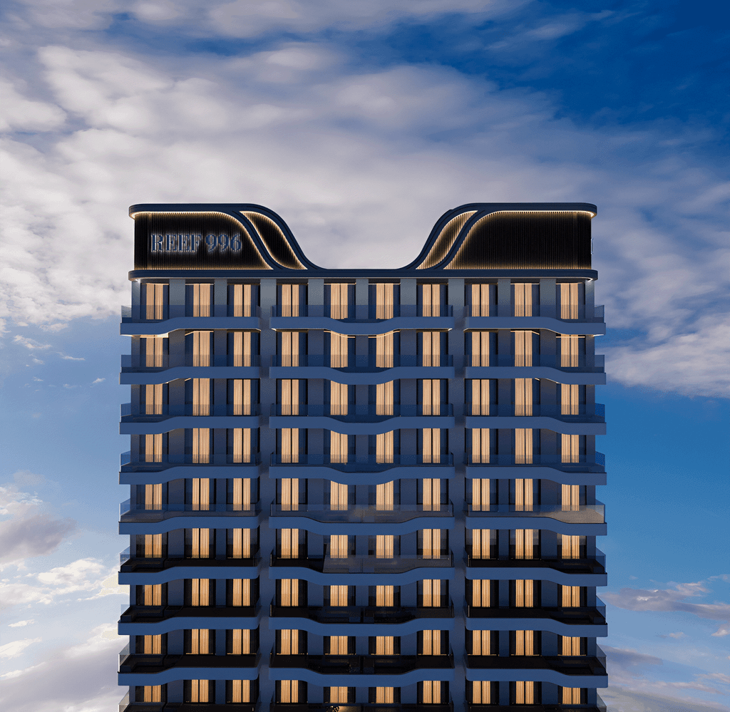 Exterior shot of Reef 996 in Dubai, highlighting its sleek design against a clear blue sky