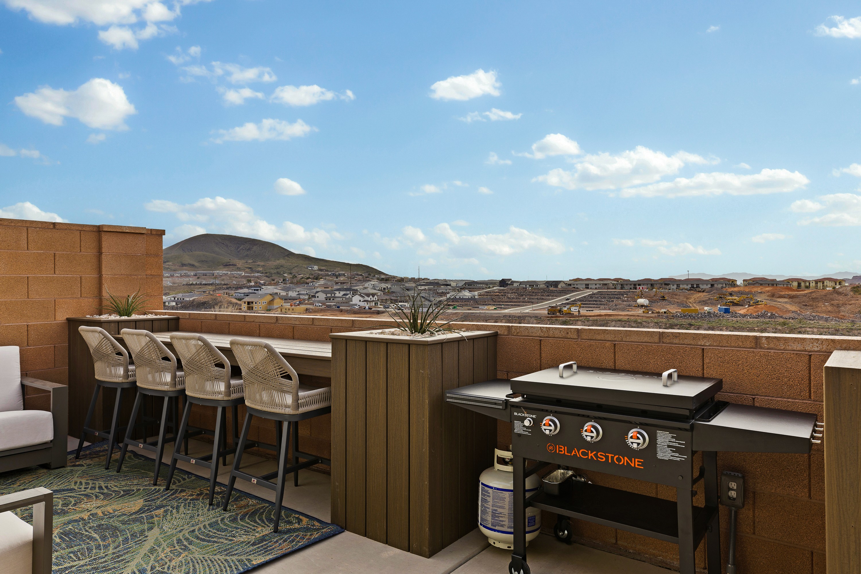 33. Outdoor seating and barbecue area at the BYSO House in Hurricane, Utah, creating a functional and inviting space for entertaining.